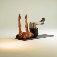 a man doing an exercise on a mat